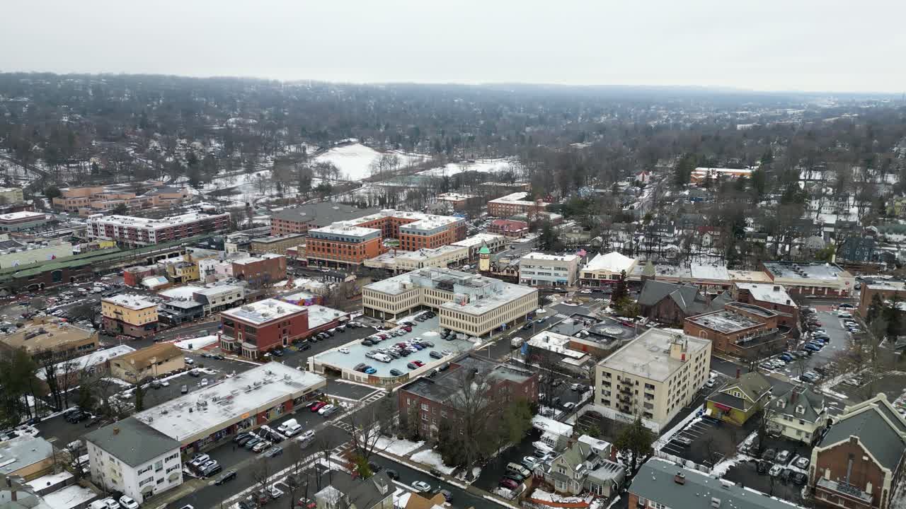 Aerial drone footage of South Jersey in winter, featuring snow-covered rooftops, streets, and urban areas. Capturing the cold season’s atmospher