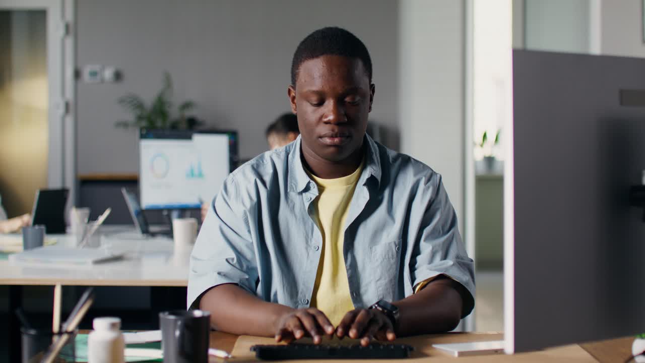 Man Working and Stressed in Office