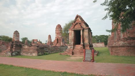 Ancient-Ruins-of-Ayutthaya-with-a-Dolly-Pull-In-Shot-of-Old-Structured-Buildings-Built-with-Red-Bricks-in-Thailand