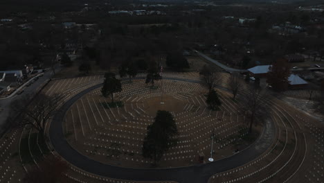 high aerial view of fayetteville white graves in circle around american flag pole