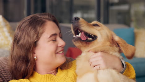 woman cuddling with her golden retriever dog