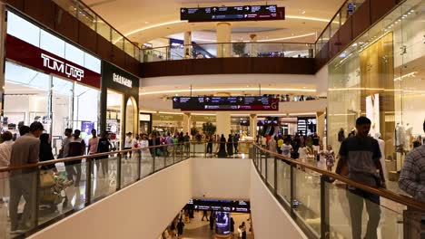 shoppers walking through a bustling department store