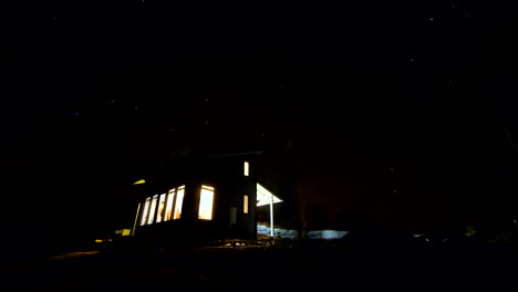 Astro-time-lapse-at-night,-deserted-forest-cottage-house-in-Nordic-national-park