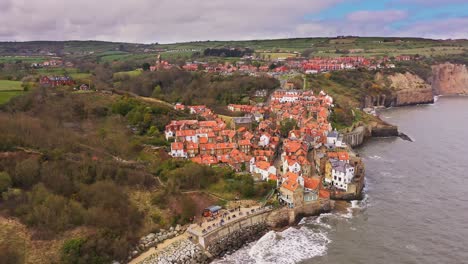 robin hoods bay harbour aerial view at high tide over fishing village