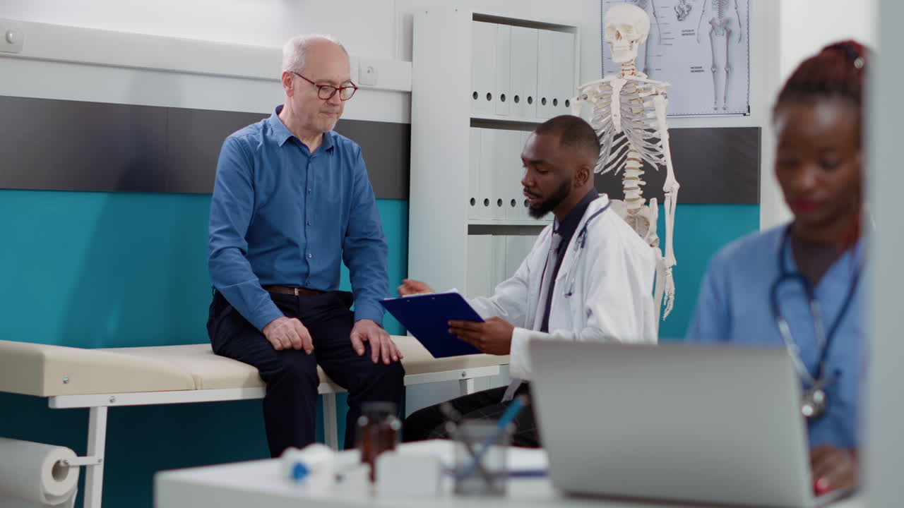 Doctor consulting with senior patient in clinic