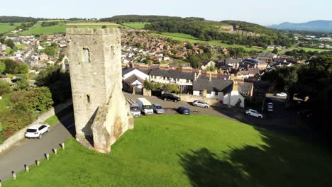 St-Hilarys-tower-Denbighshire-residential-village-North-Wales-aerial-low-orbit-right-view