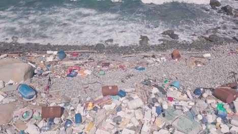 climate change environmental impact of beach covered in plastic and rubbish in hong kong. aerial drone view