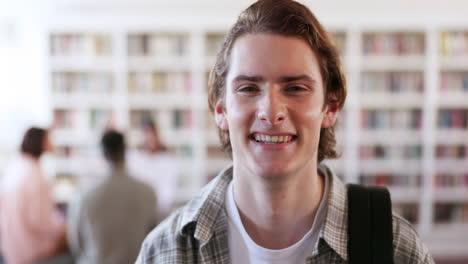 education, smile and library with face of man