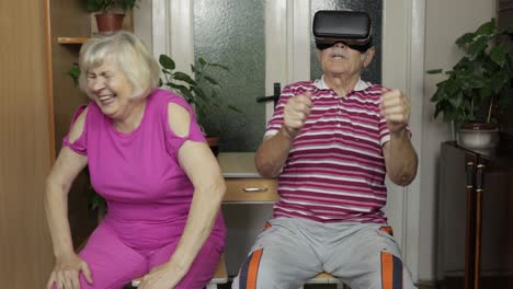 Grandmother-puts-on-grandfather-helmet-for-VR-headset.-Playing,-watching-videos-in-virtual-reality
