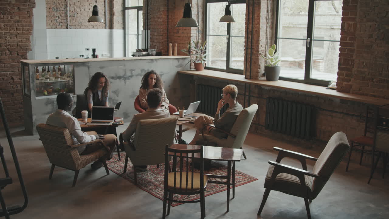 Business Team on Meeting in Modern Coworking Loft Office