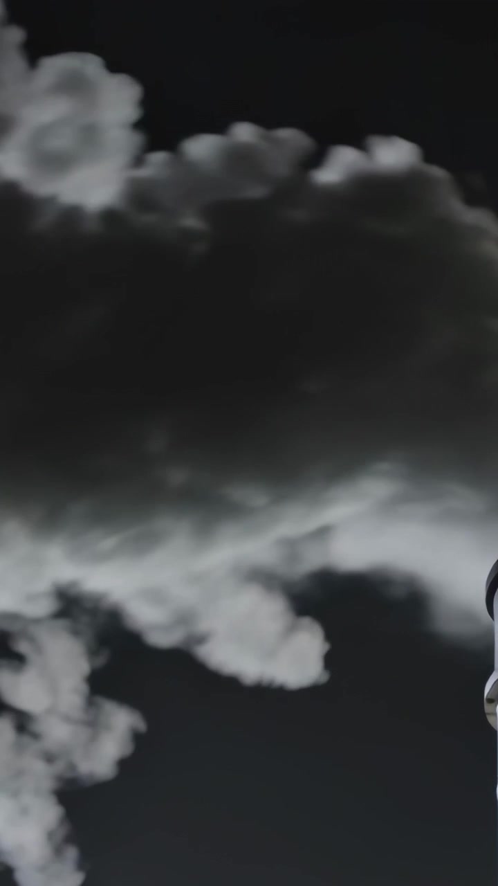 Vertical video: Gusting wind pushing large cloud rolling across dark sky over roof, stack and wisps