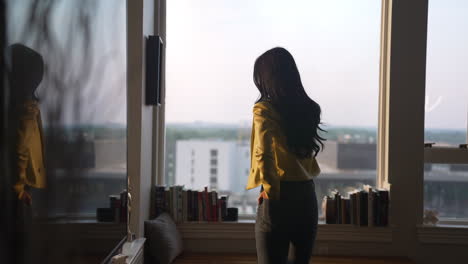 a woman talking on her cell phone in her home office, important conversation, communication, entrepreneur, home office, talking, remote work, business