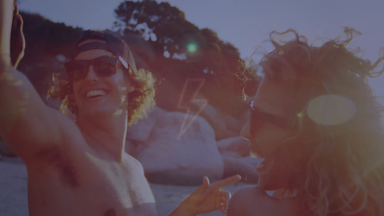 Young people enjoying beach party with colorful light animation overlay