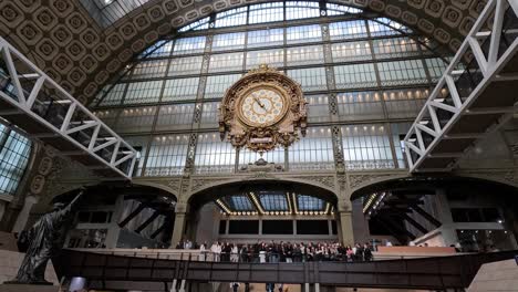 crowds gather and move through museum's grand hall