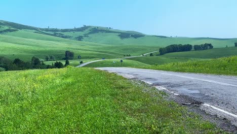 a serene journey through lush green hills and open roads under clear blue skies, capturing the beauty of nature's splendor in tranquil landscapes