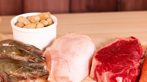 various protein sources arranged on a wooden table