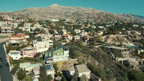 Hillside-Homes-in-Manzanares,-Spain.-Aerial-flyover