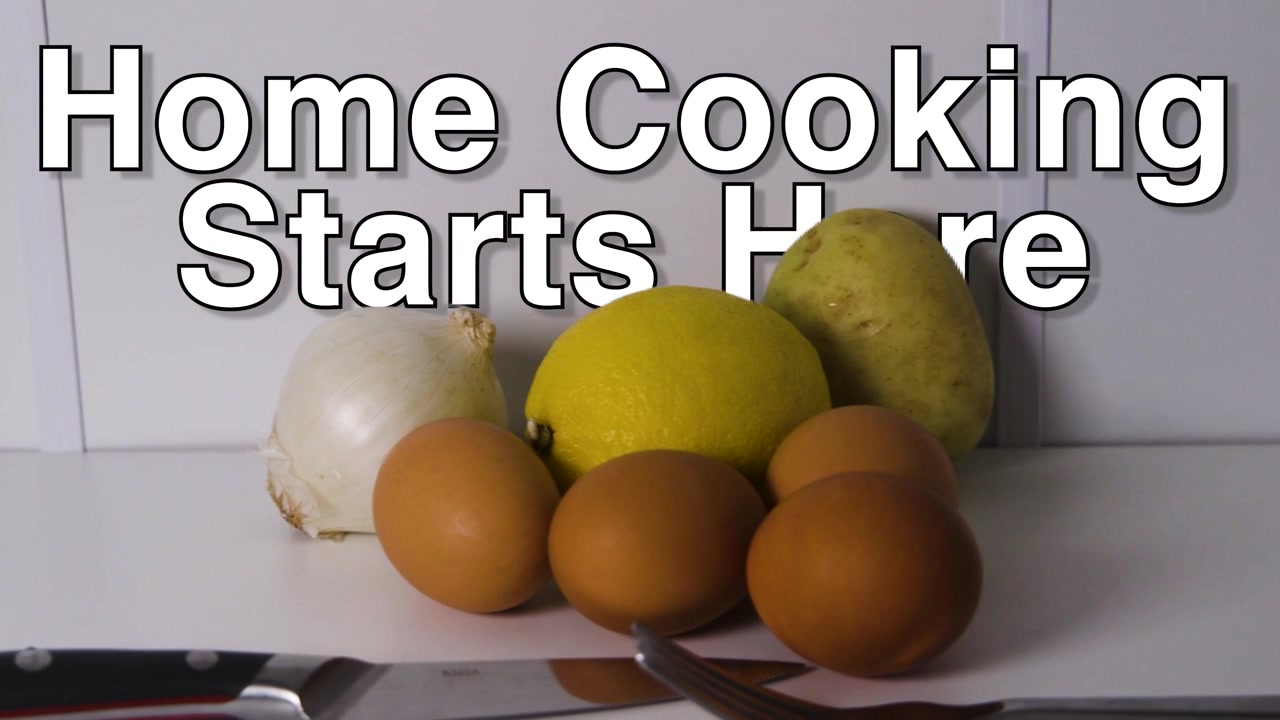 Home Cooking Starts Here text sits over raw staples including eggs, lemon, potato, onion, fork and chef knife on a plain surface.