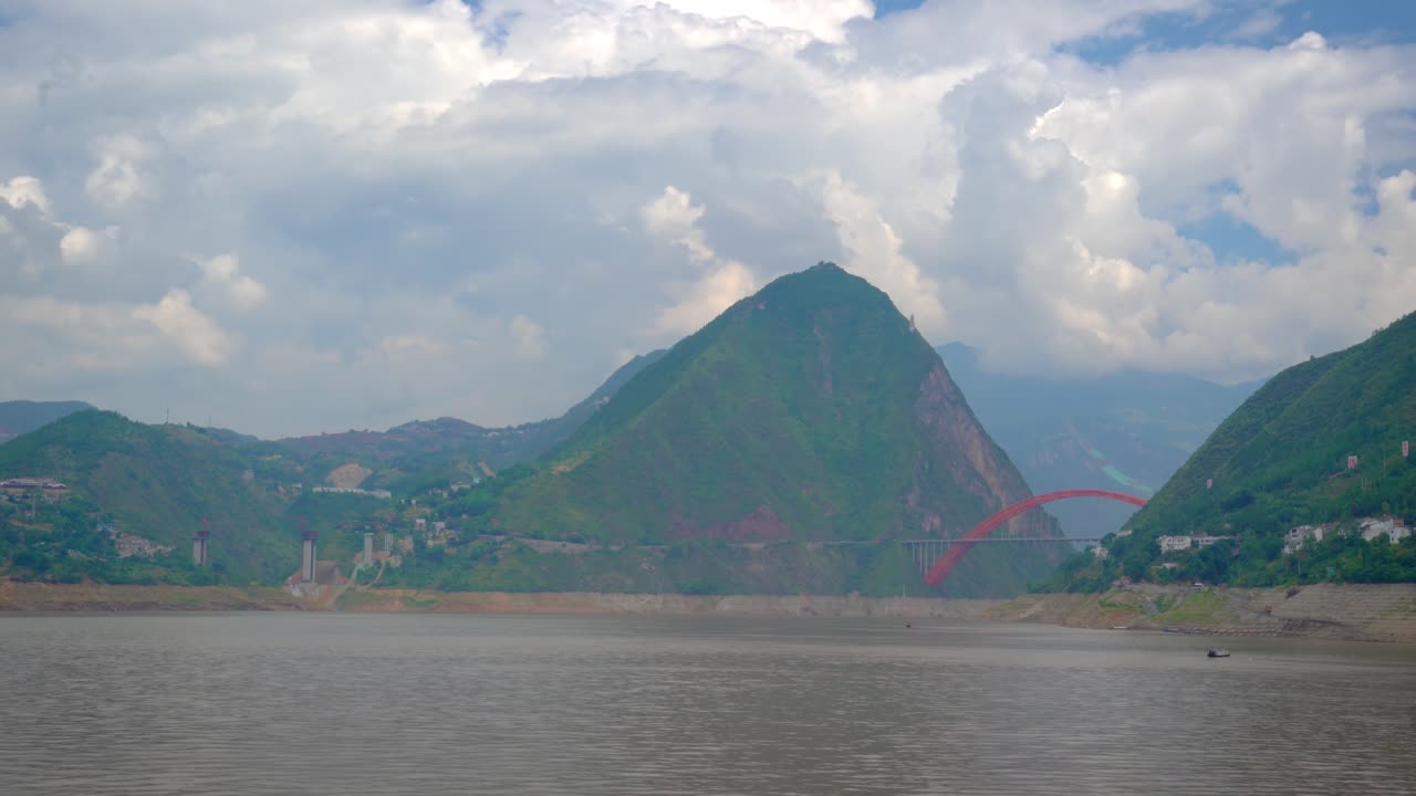 Scenic View of a Red Arch Bridge Over a River in China
