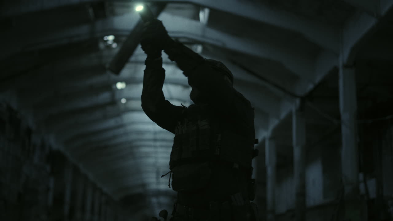 Silhouette of a soldier in a dark tunnel