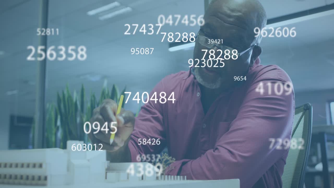 Animation of numbers and data processing over african american businessman working in office
