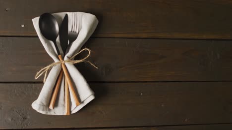 video of cutlery and cloth lying on wooden surface