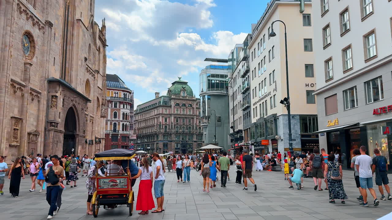 Vienna, Austria - June 9, 2025: Plenty of people on the square in front of the Saint Stephen's Cathedral. View on the historical part of Vienna, Austria