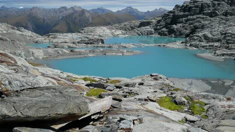 blue glacial lake in alpine hanging valley
