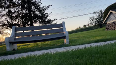 local-sidewalk-bench-in-small-town