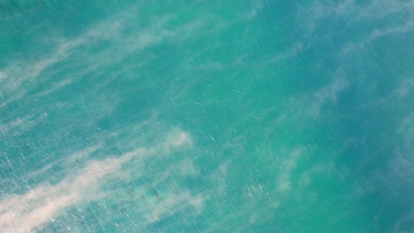 sea mist above water surface at the coolum beach in queensland, australia