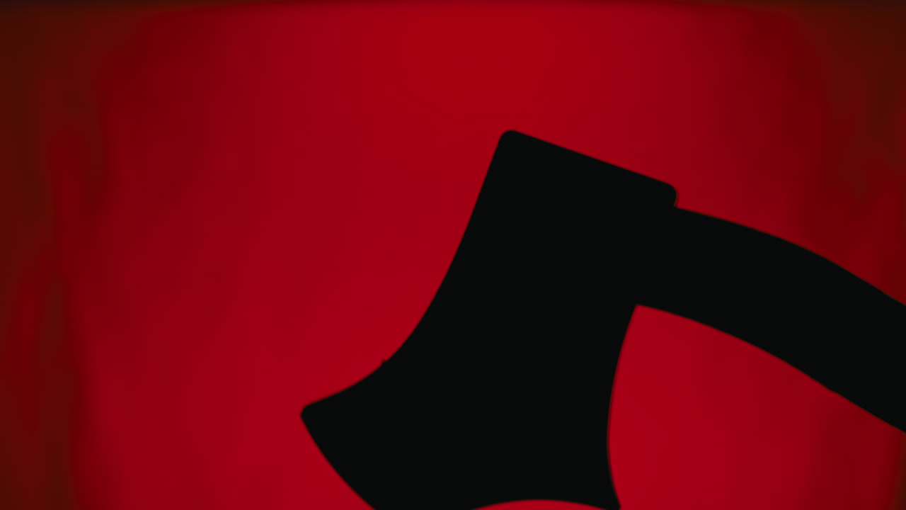 Axe Silhouette Moving on Red Background for Halloween horror time