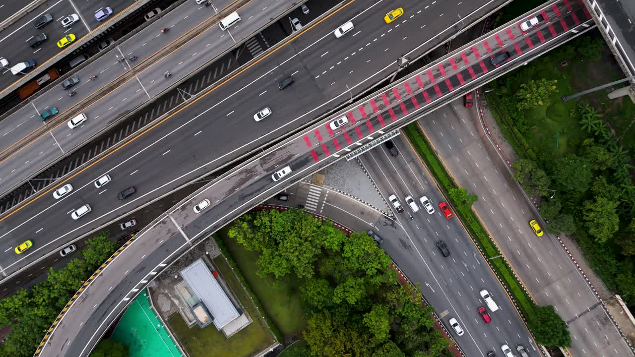 Top Down Drone Shot of Urban Infrastructure With Freeway System and Road Junctions