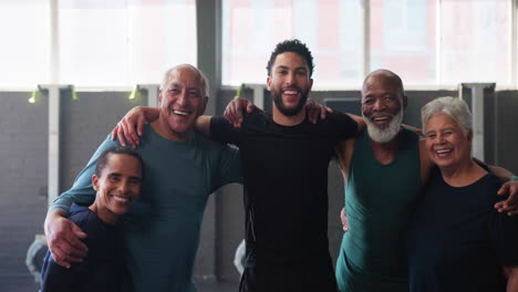 group of people smiling and working out in a gym