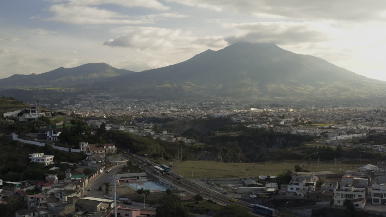 Panoramic View of a Cityscape Nestled at the Base of Mountains