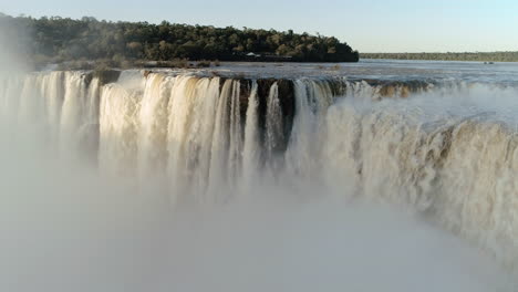 Iguazu-Falls,-Argentina-"Devil's-Throat",-featuring-a-stunning-rainbow-above-the-waterfall,-Elected-one-of-the-seven-wonders-of-the-world