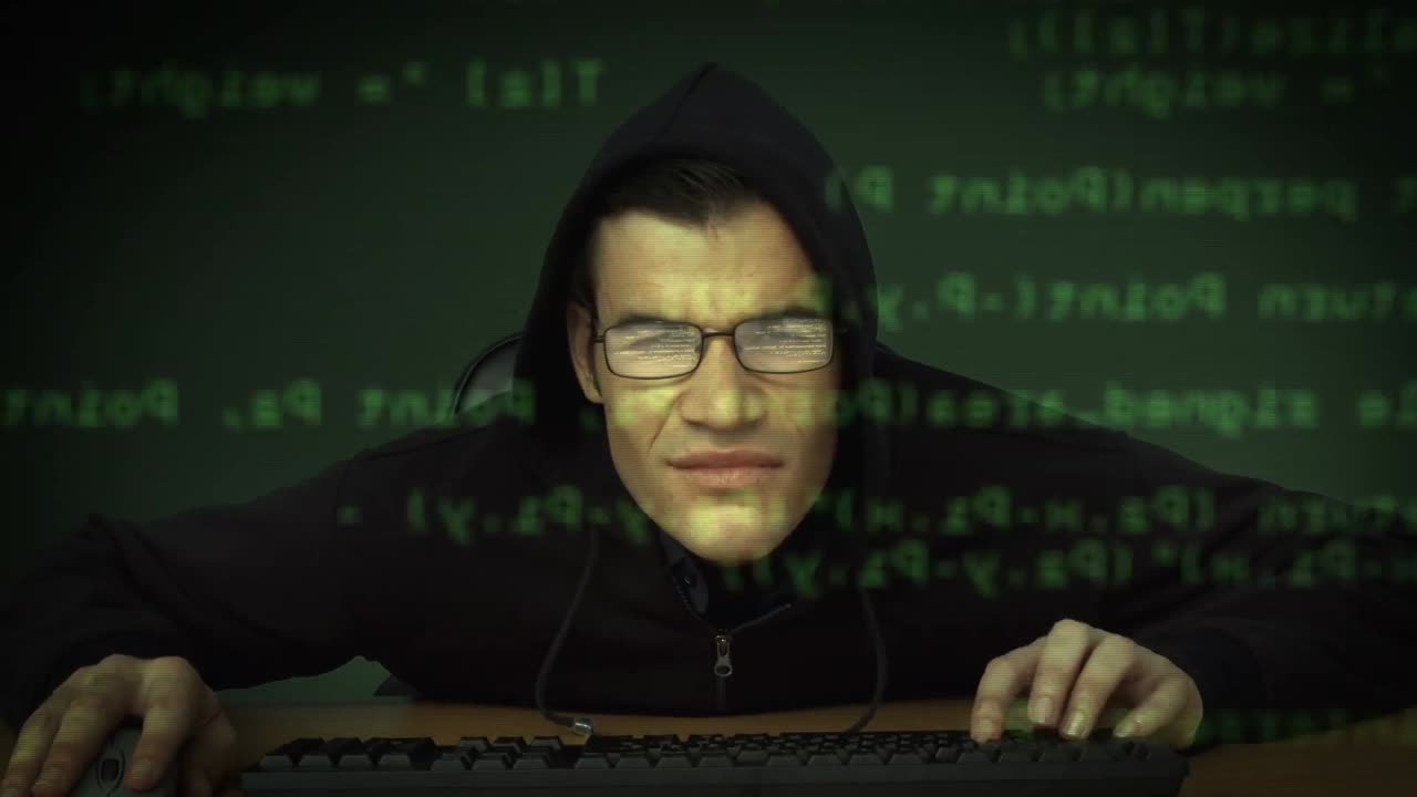 Burglar hacking into computer
