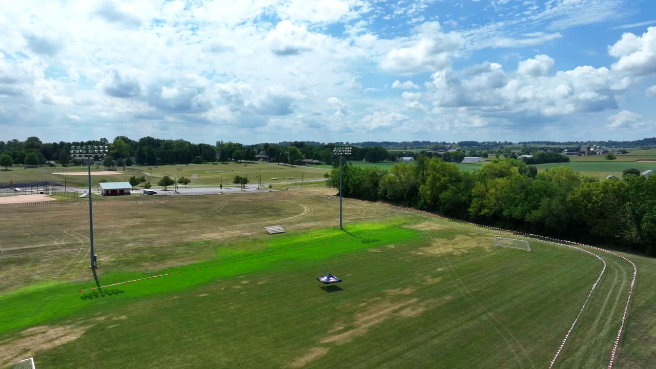 American flag waving above empty cross country race course