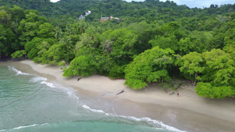 aerial view of coastline with remote beach in manuel antonio nature reserve in costa rica