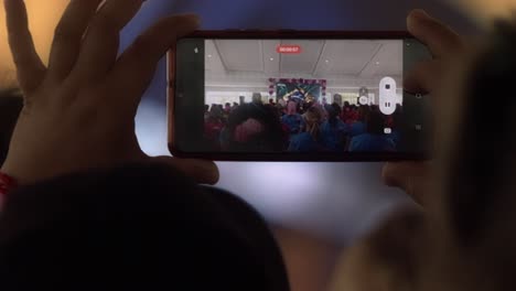 mobile technology, room interior presentation, people spectating