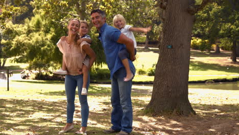 happy family playing in the park together