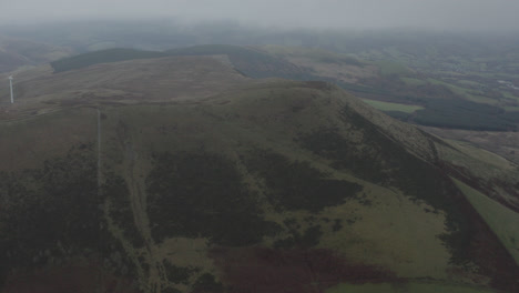 Drone-shot-of-rolling-english-countryside-with-hills-and-fields