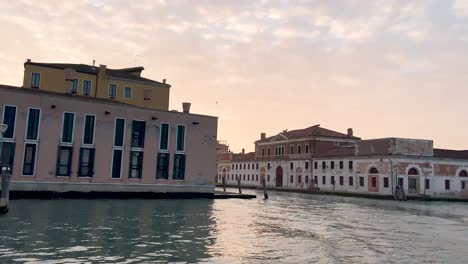 Riding-The-Vaporetto-Ship-And-Turning-Out-Into-The-Outskirts-Of-Venice,-Italy-During-Sunrise