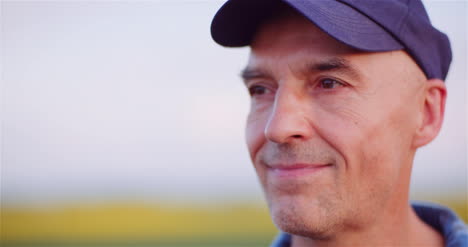 Positive-Adult-Farmer-Smiling-Into-Camera-At-Field-Agriculture-3