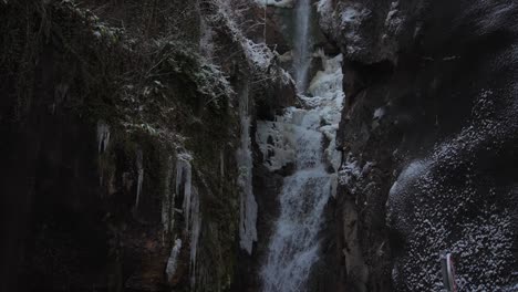 clip of a frozen waterfall filmed in europe in austria from a town called hallstatt