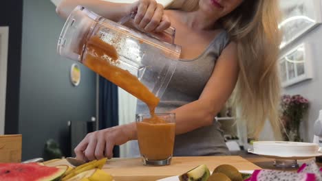 woman making a smoothie