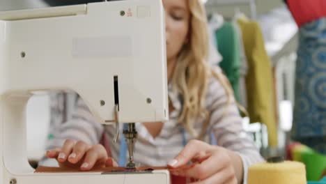 young woman working in a fashion studio