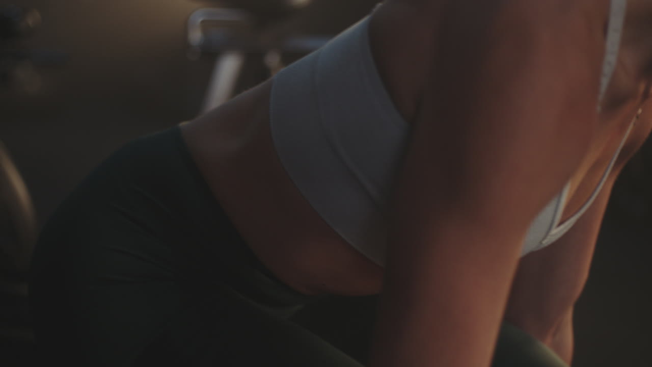 Woman's toned midsection at the gym