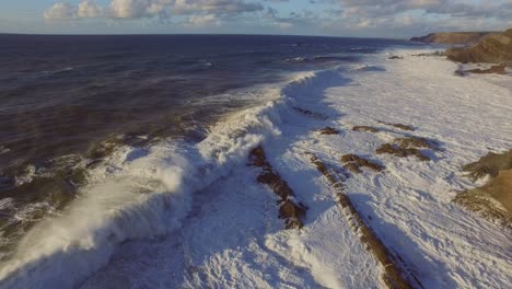 Big-waves-at-the-most-south-western-point-of-Europe,-Cabo-de-São-Vicente-and-Sagres-in-the-Algarve,-Portugal