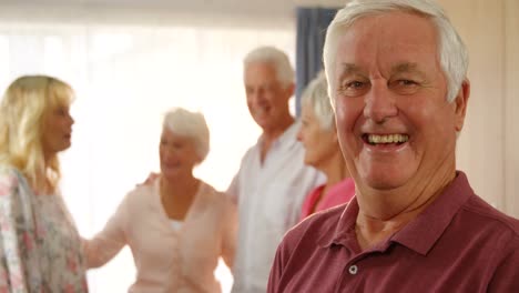 portrait of happy senior man spending time with his friends