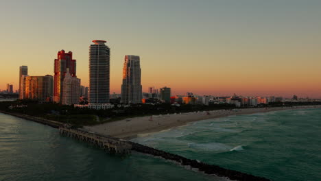 miami beach skyline at south point during sunset glow
